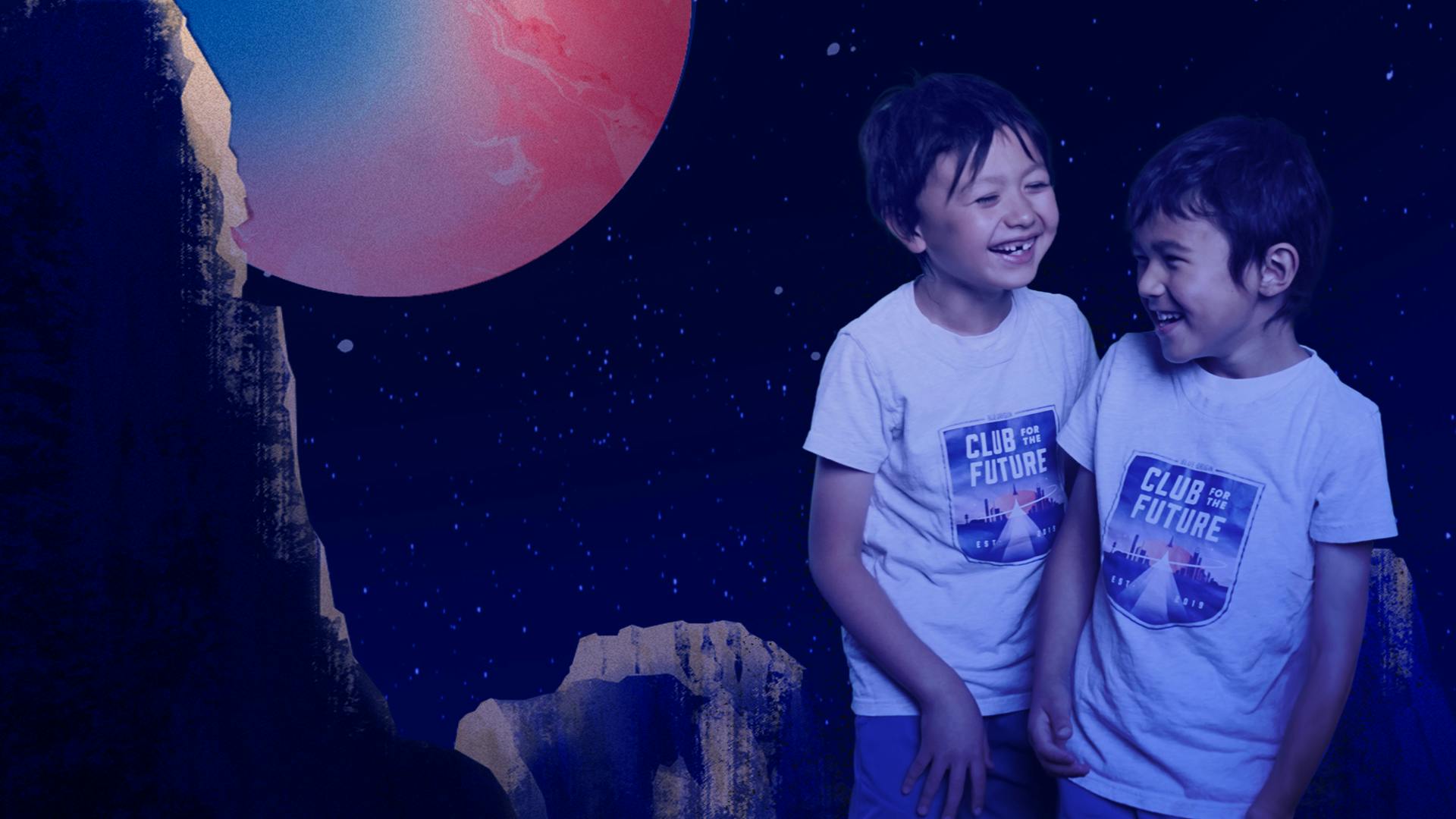 Two young kids laugh together, wearing 'Club for the Future' T-shirts